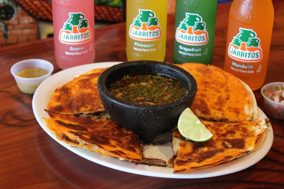 Freshly served entrées on white plates.